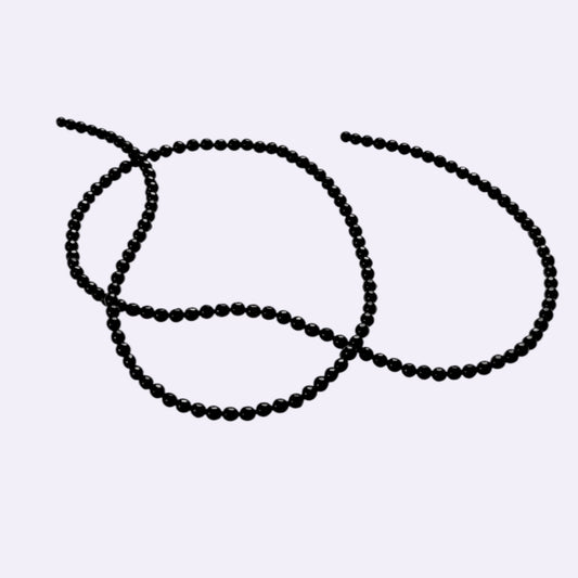 Natürlicher Onyx - Strang 50 cm | 3 mm | Facettierte Buttonform | Tiefschwarz